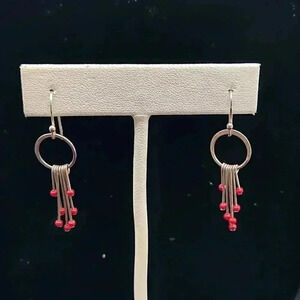 Sterling silver one and a half inch dangle chandelier earrings with red stones